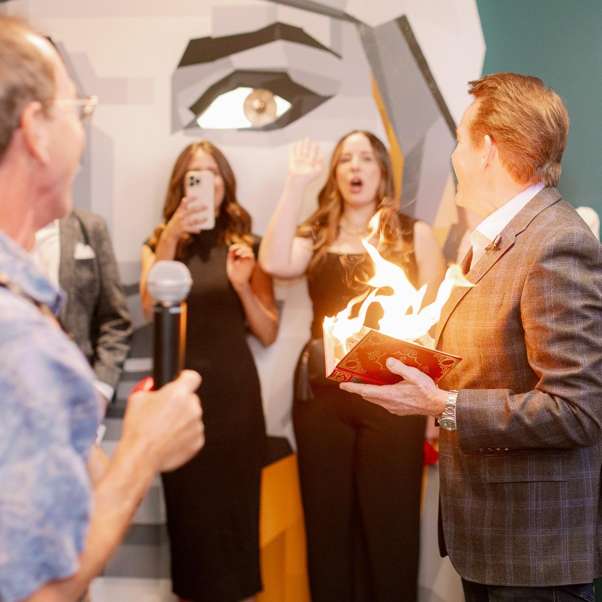 Guest participating in an interactive illusion performance at an event, with a live demonstration creating a surprising visual effect for the audience.